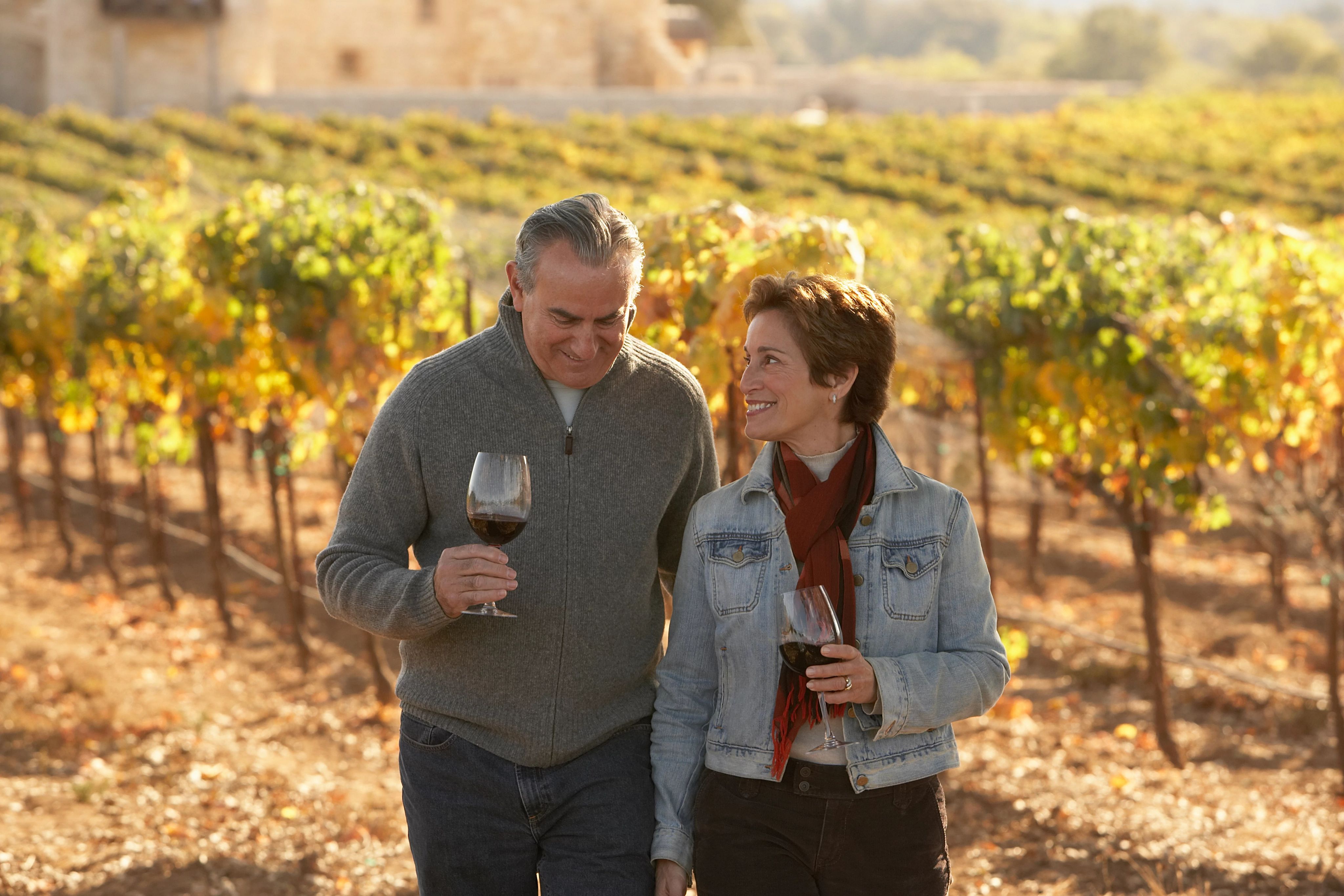 Couple walking wine vineyards