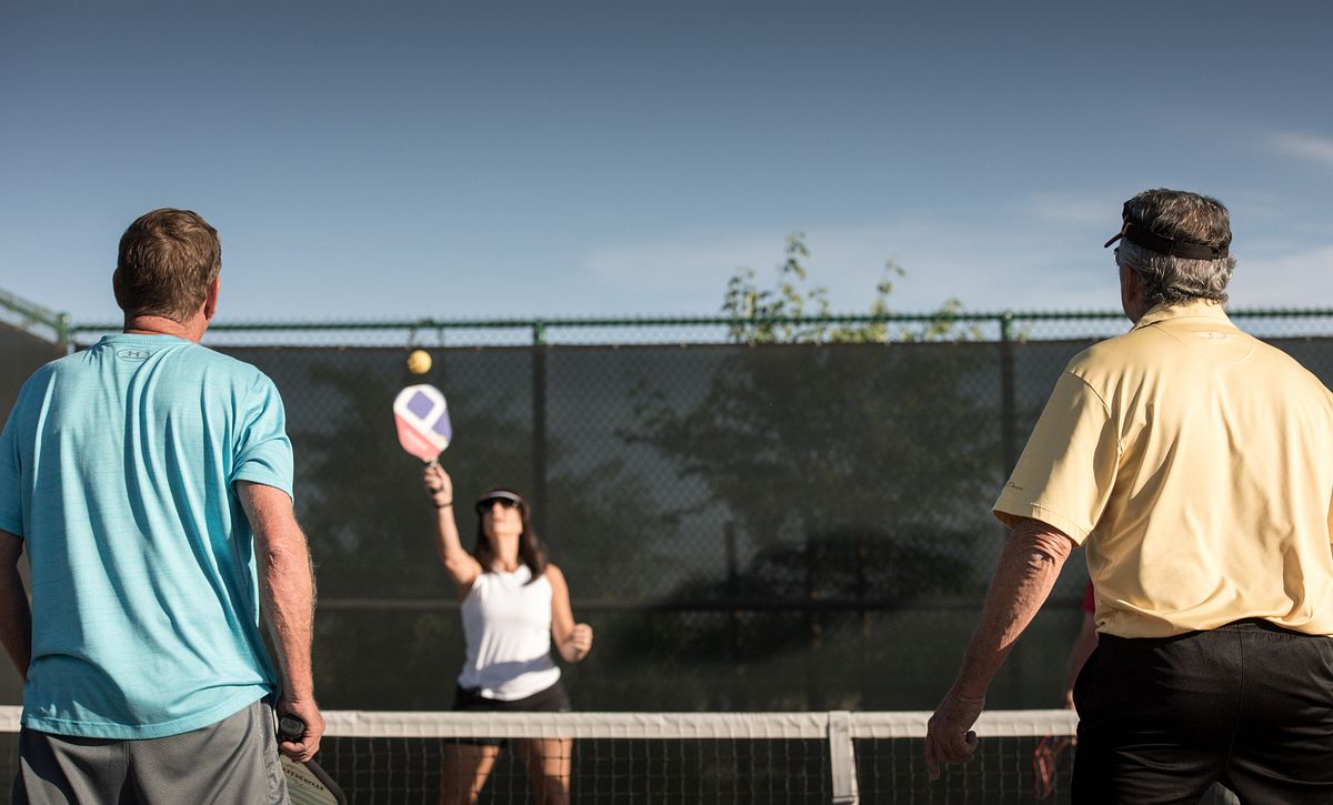 Group of people playing Pickleball