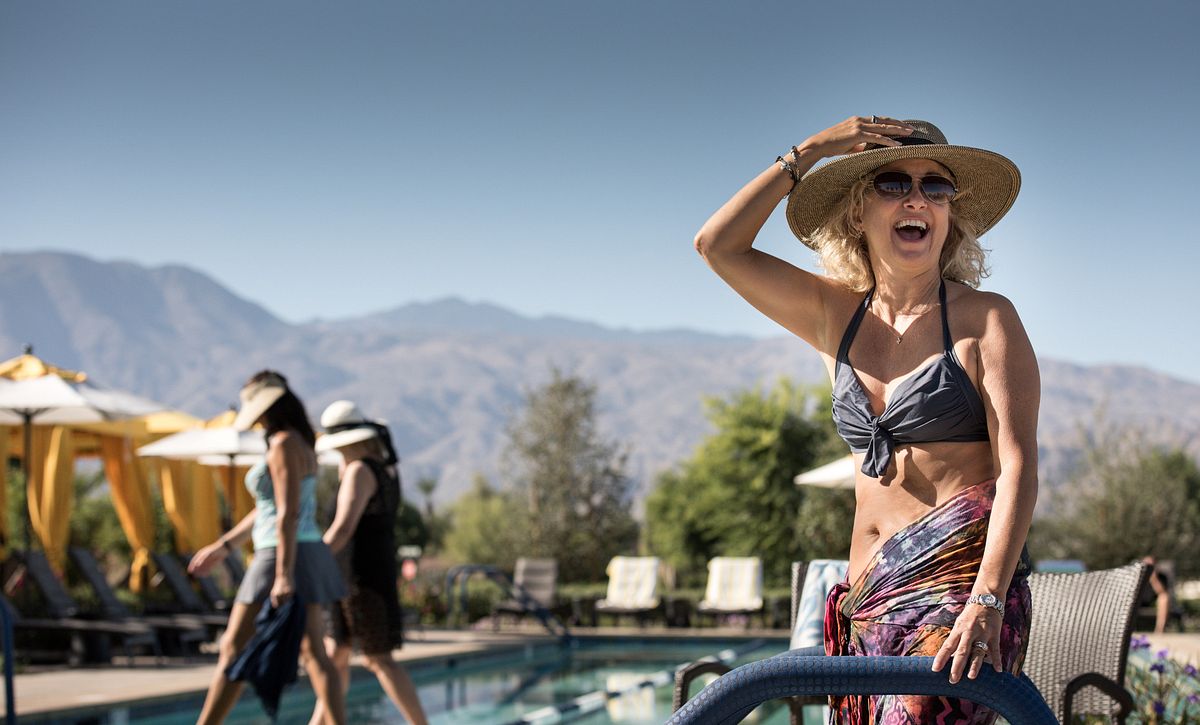 Woman in a hat at the Pool at Trilogy at Polo Club