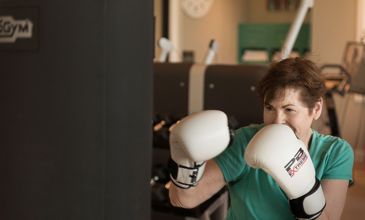 Lady working out with boxing gloves